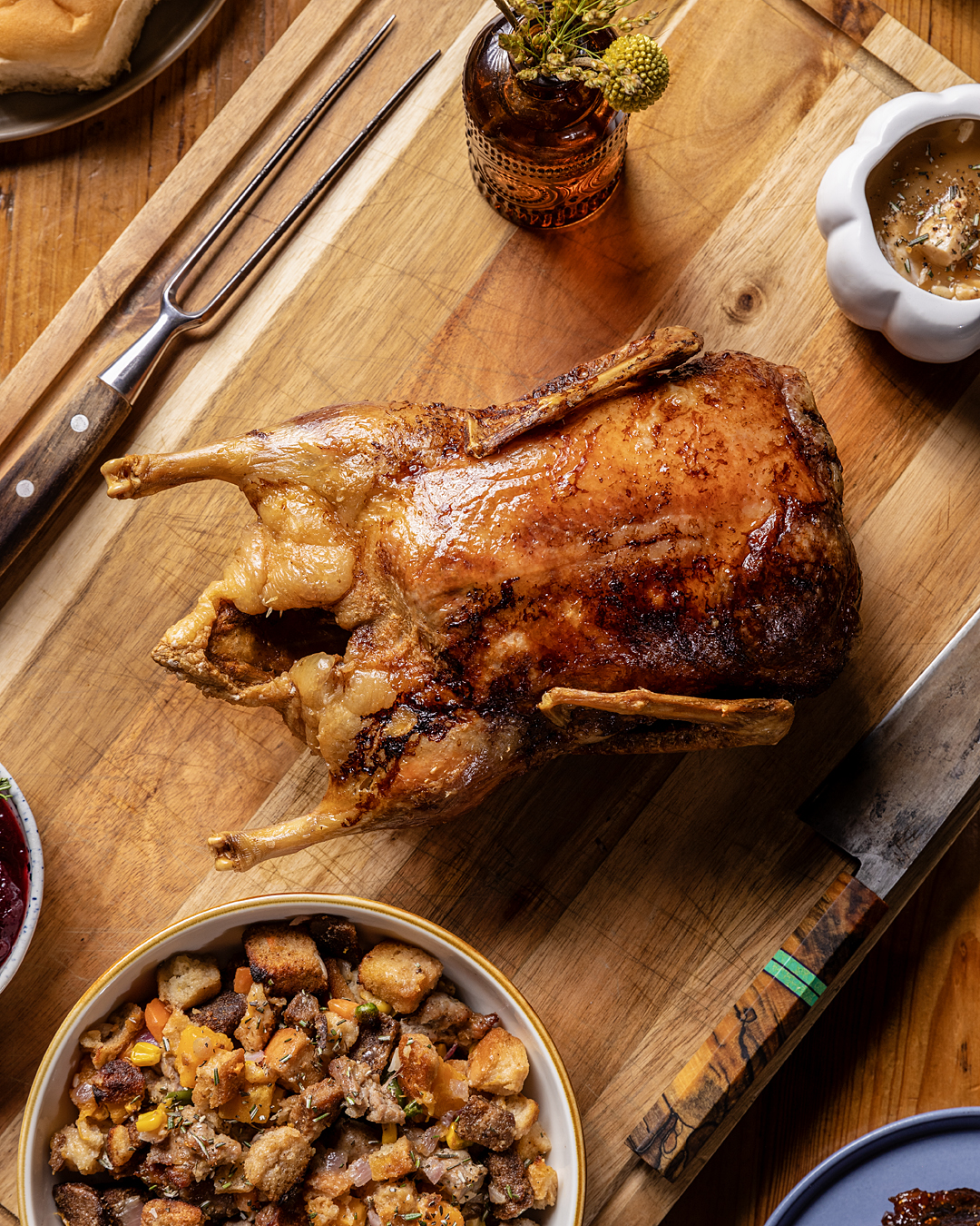 Roast duck on a carving board with stuffing