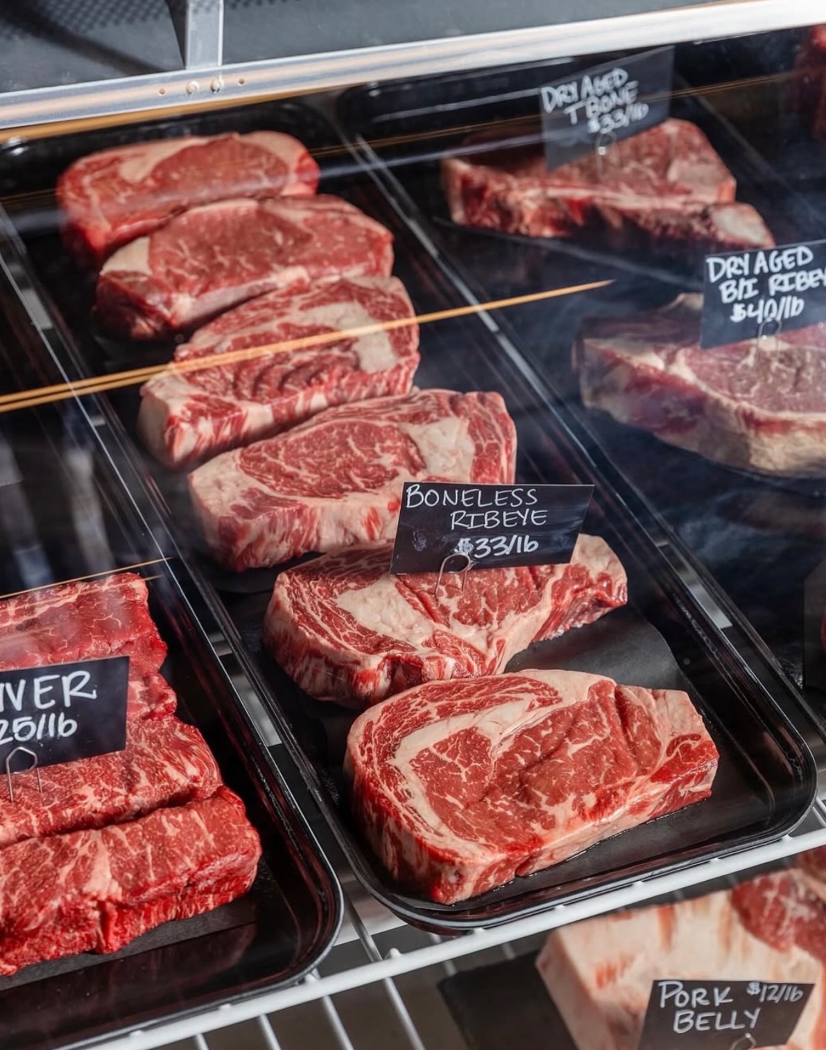 The Marrow butcher shop counter and glass-walled processing facility