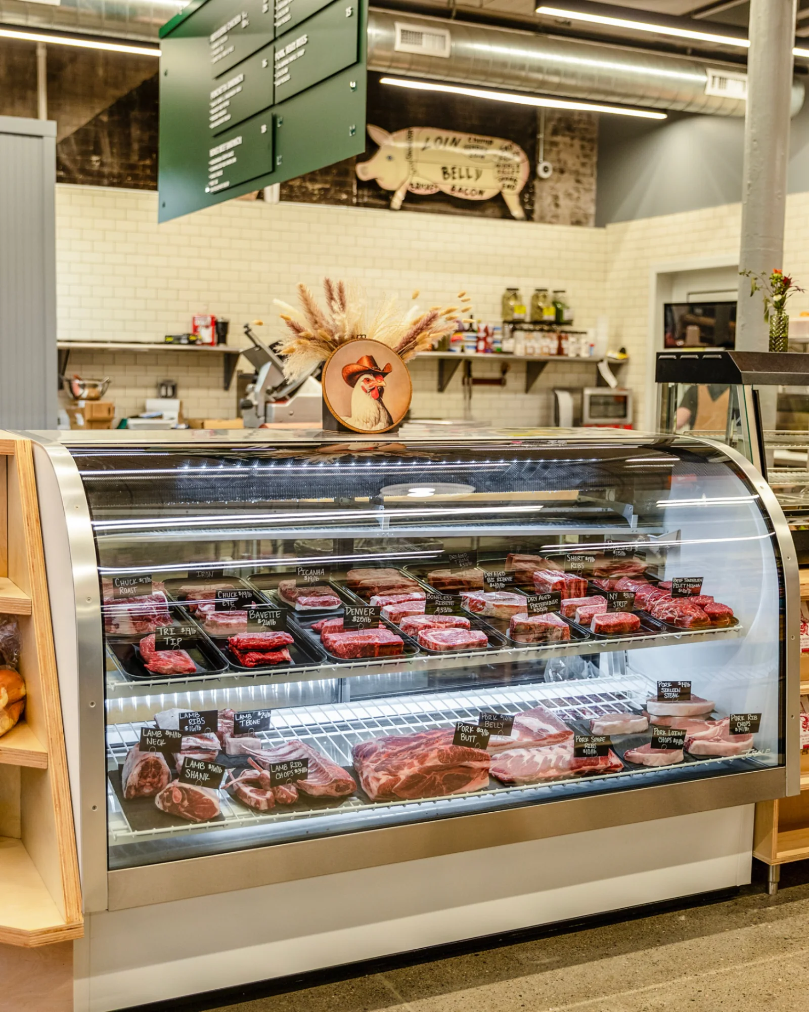 Butcher shop counter and glass-walled processing facility
